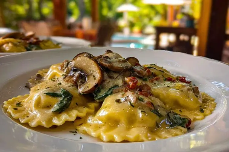 Creamy mushroom ravioli topped with sliced mushrooms and herbs, served in a white bowl on a cozy outdoor dining table.