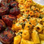Rigatoni in Garlic Butter Parmesan Cream Sauce with Cajun Steak Tips